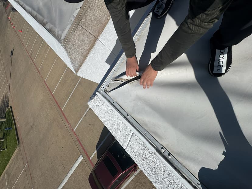 Commercial roofer repairs roof.