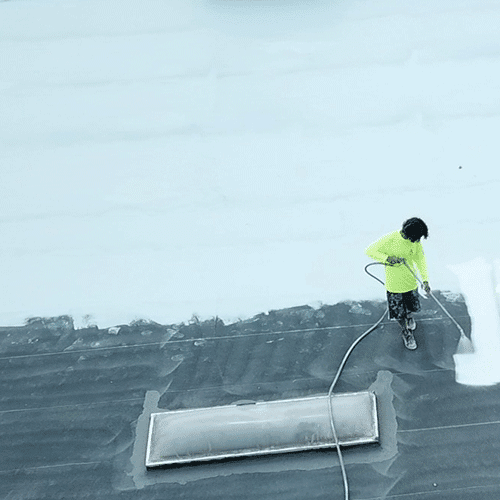 Contractor applies silicone coating.