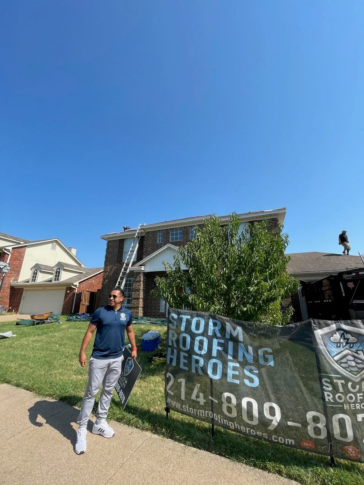 Residential roofer with banner