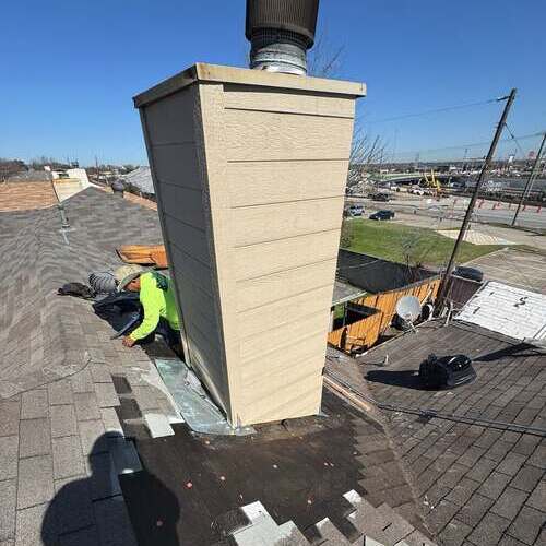 Roofers work on roof repair.