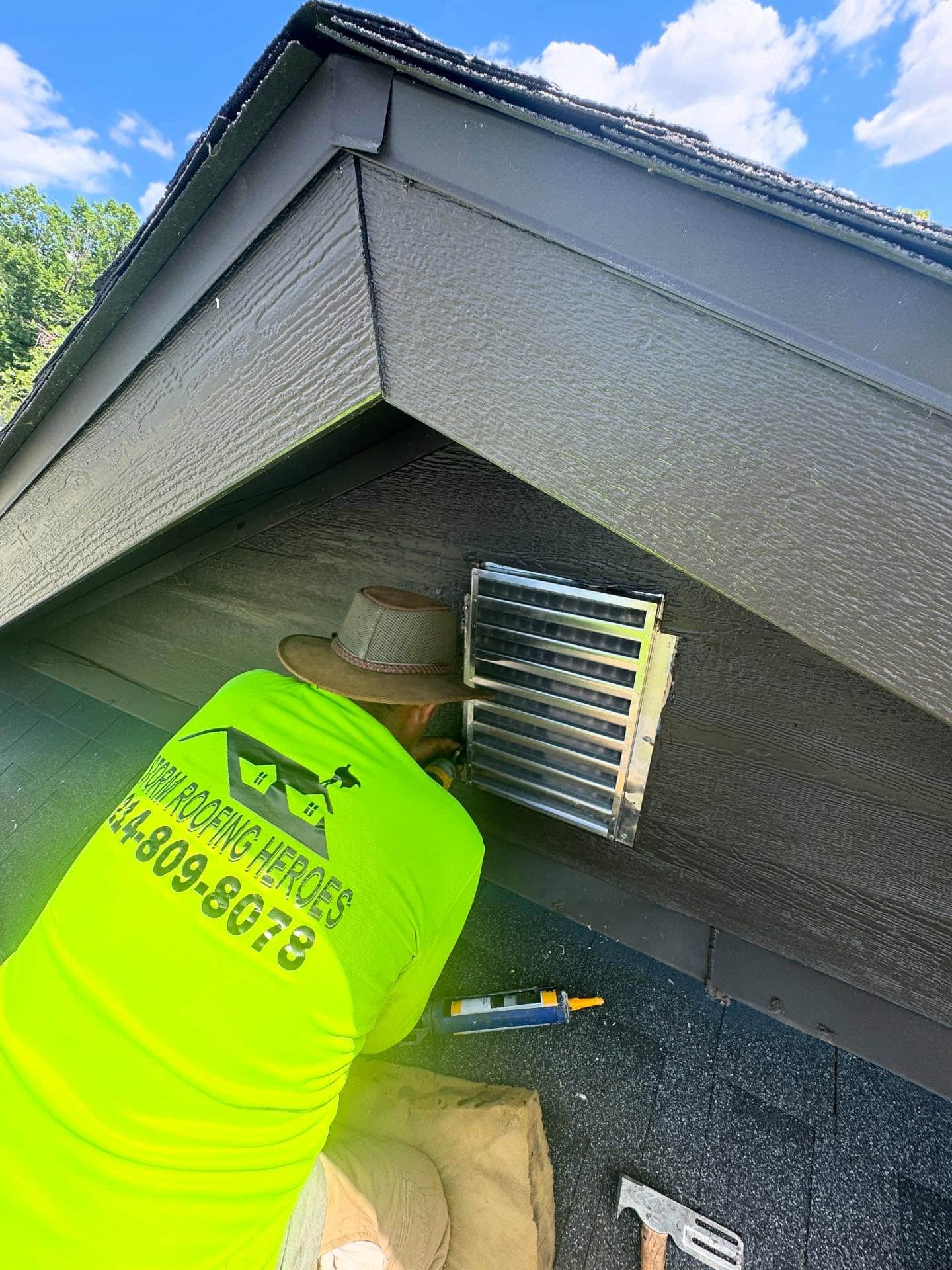 Roofer works on venting.